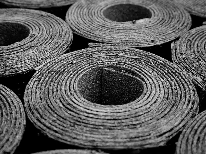 Rolls of bitumen compounds used for roof sealing.